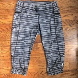 Athleta black, grey and white stripe capri tights size M.